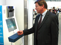 Inserting Clear card at Clear lane kiosk